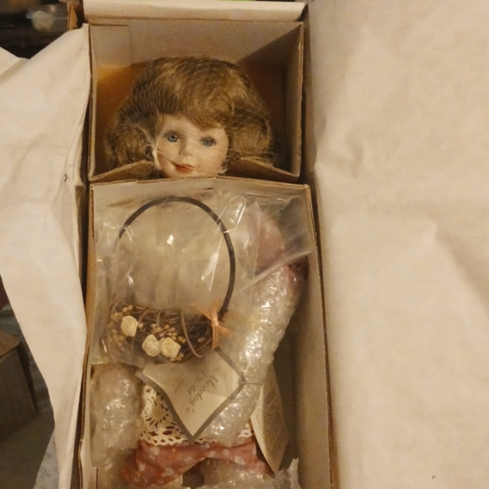 Mondays child porcelain doll